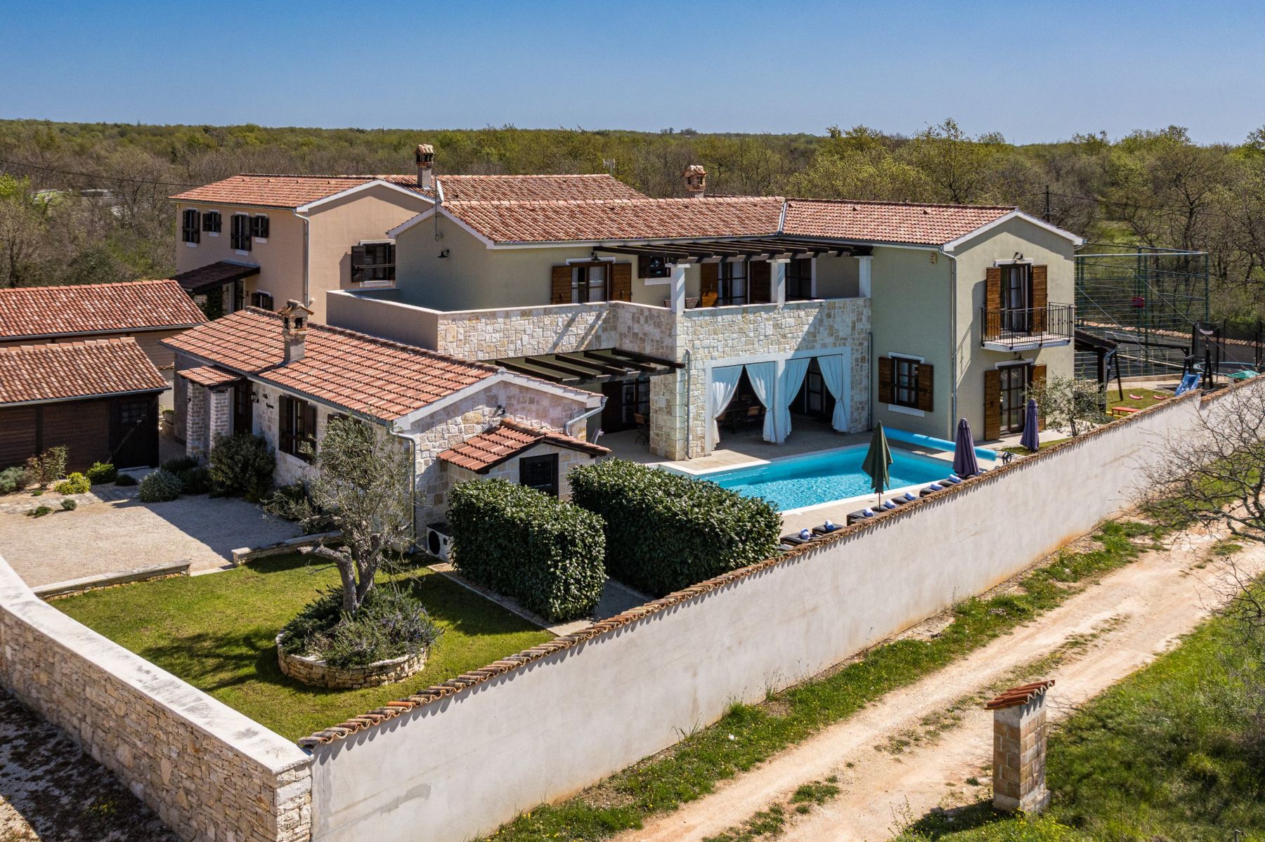 Villa Rajana from above, with the heated pool and stone terrace
