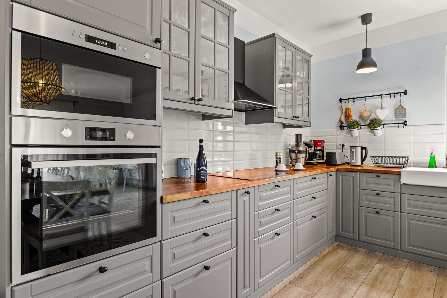 Built-in oven and microwave with wooden worktops and coffee machines